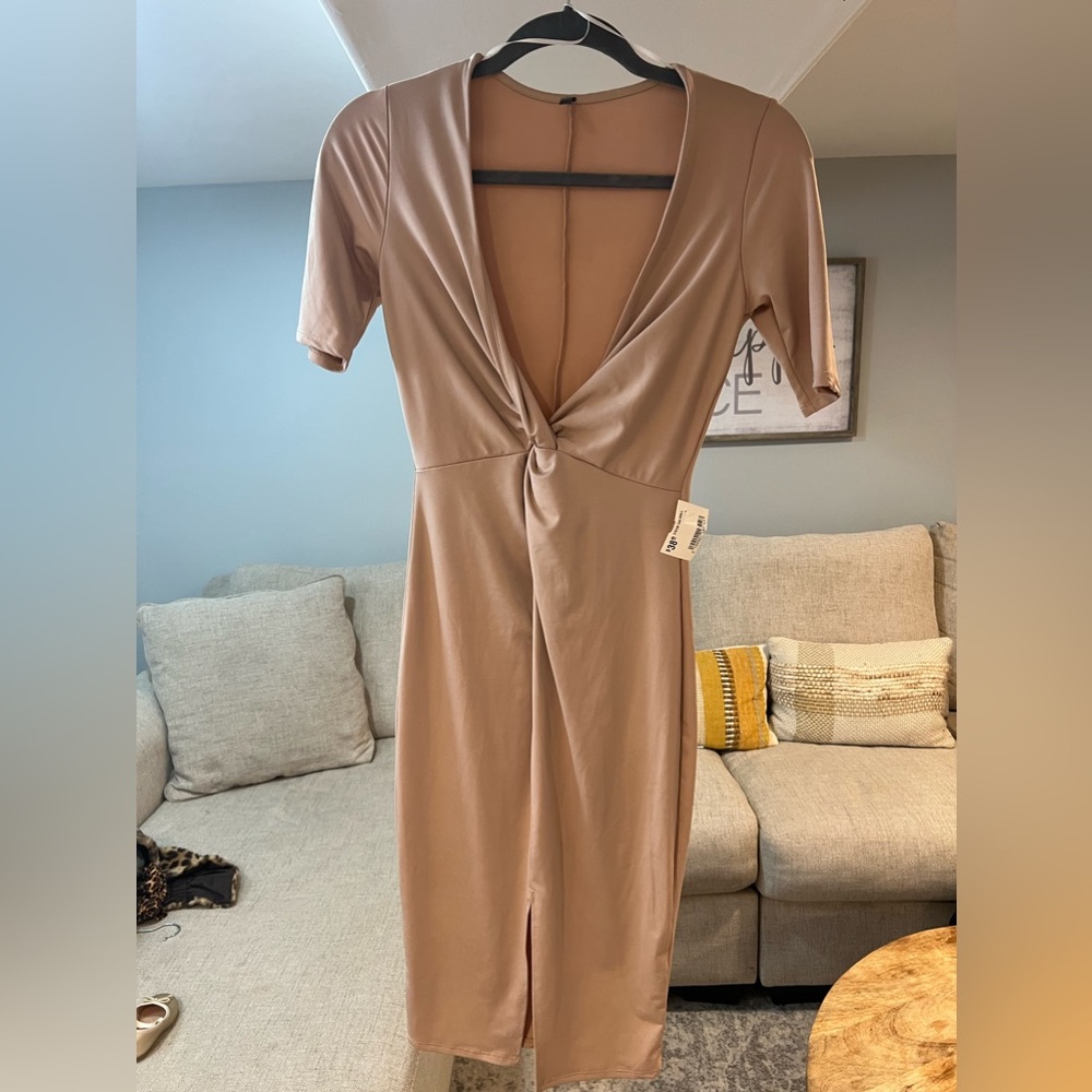 Three-quarter sleeve body con dress, deep v cut with a knot and spilt at bottom